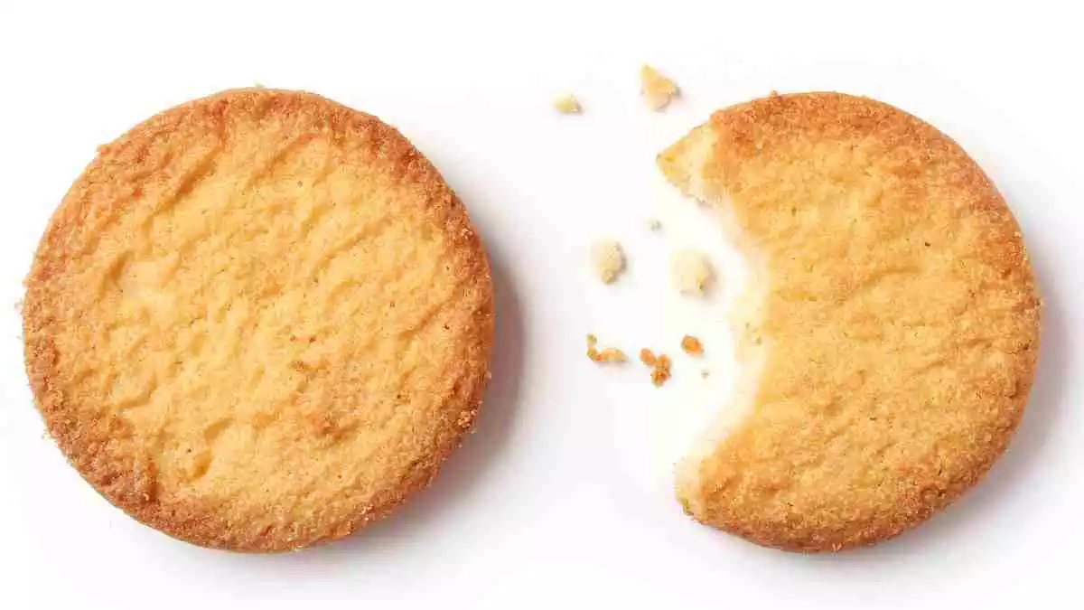 A full butter cookie and another one bitten