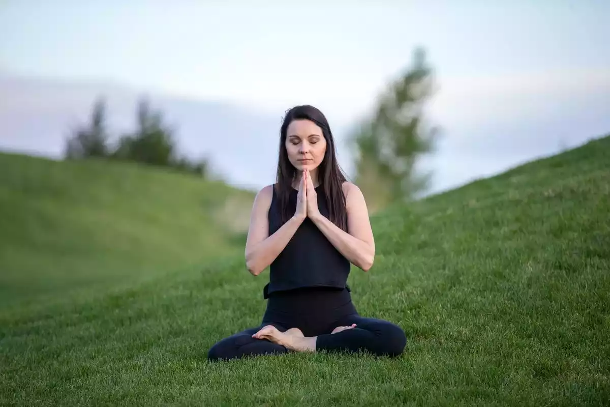 A woman practicing meditation